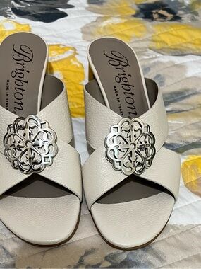 Brighton “Alison” Ivory Leather Slide Mules with Silver Medallions